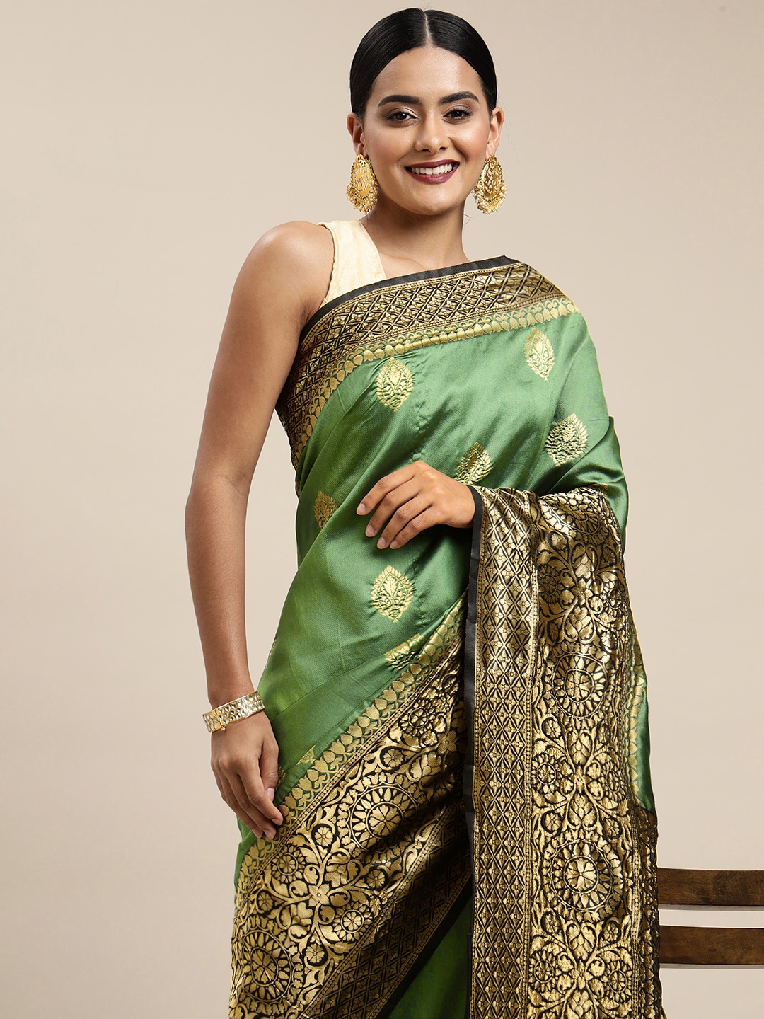 

Mitera Green & Black Ethnic Motifs Zari Silk Blend Saree