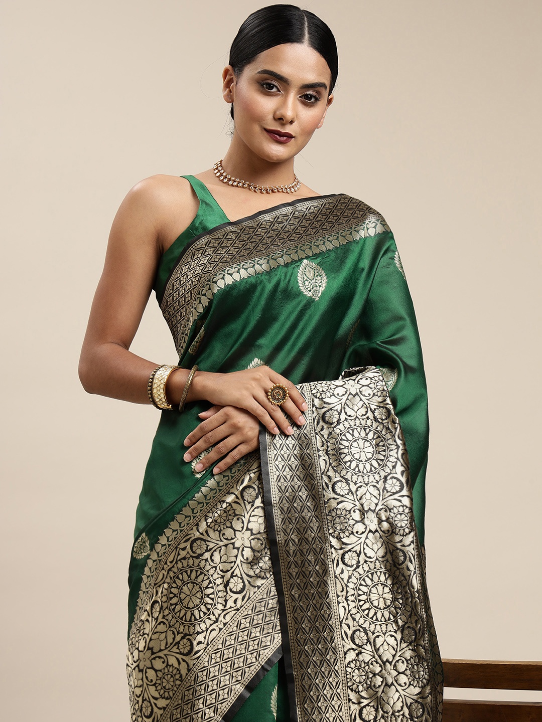 

Mitera Green & Black Ethnic Motifs Zari Silk Blend Saree