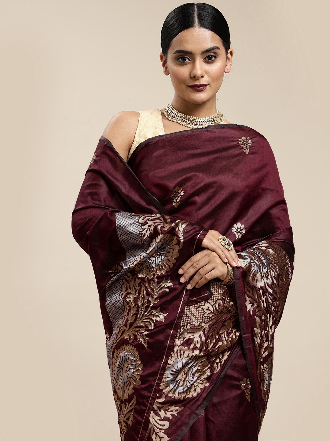 

Mitera Burgundy & Golden Ethnic Motifs Zari Silk Blend Saree