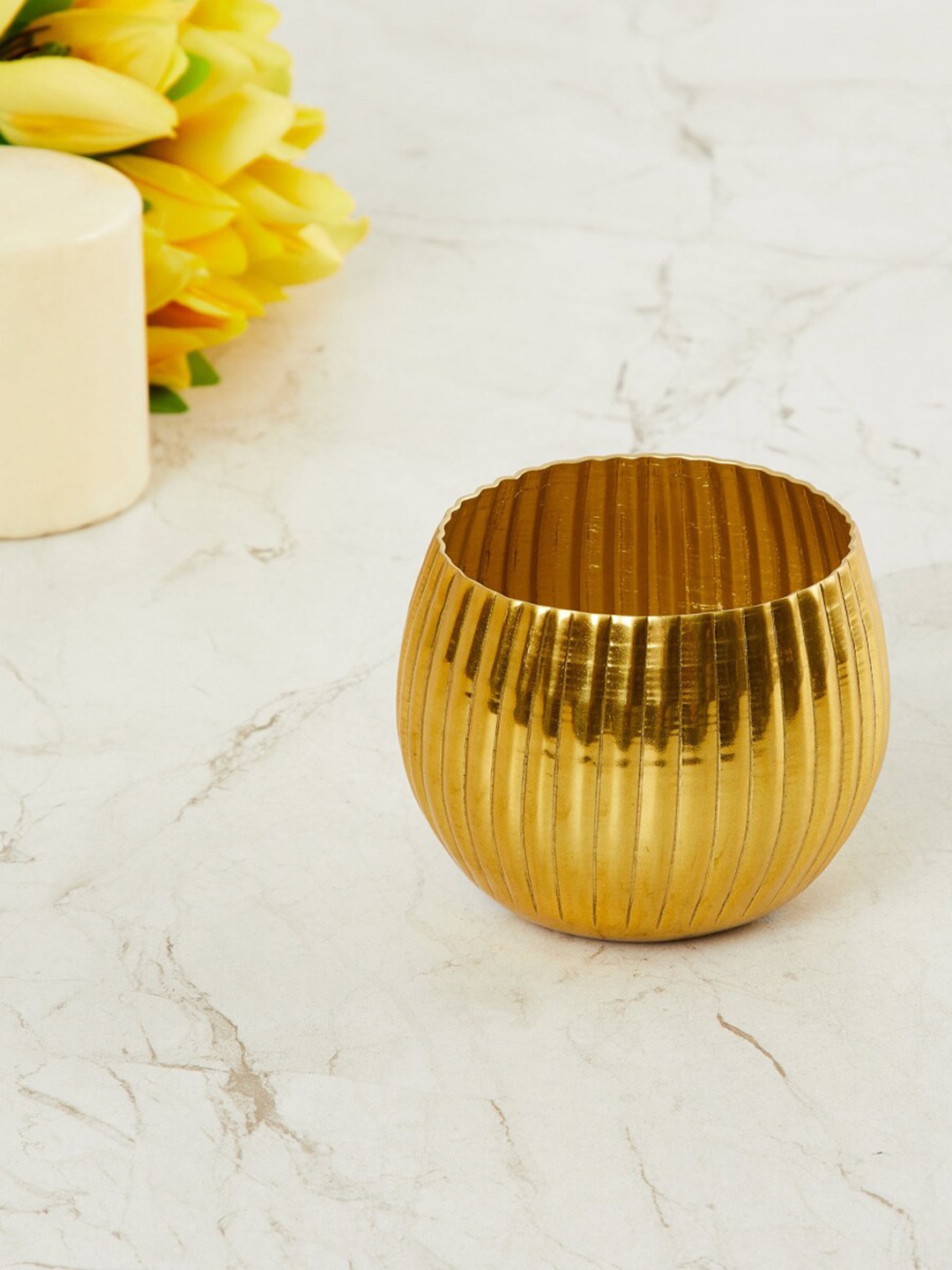 

Home Centre Gold-Toned Leon Cesar T-Light Candle Holder