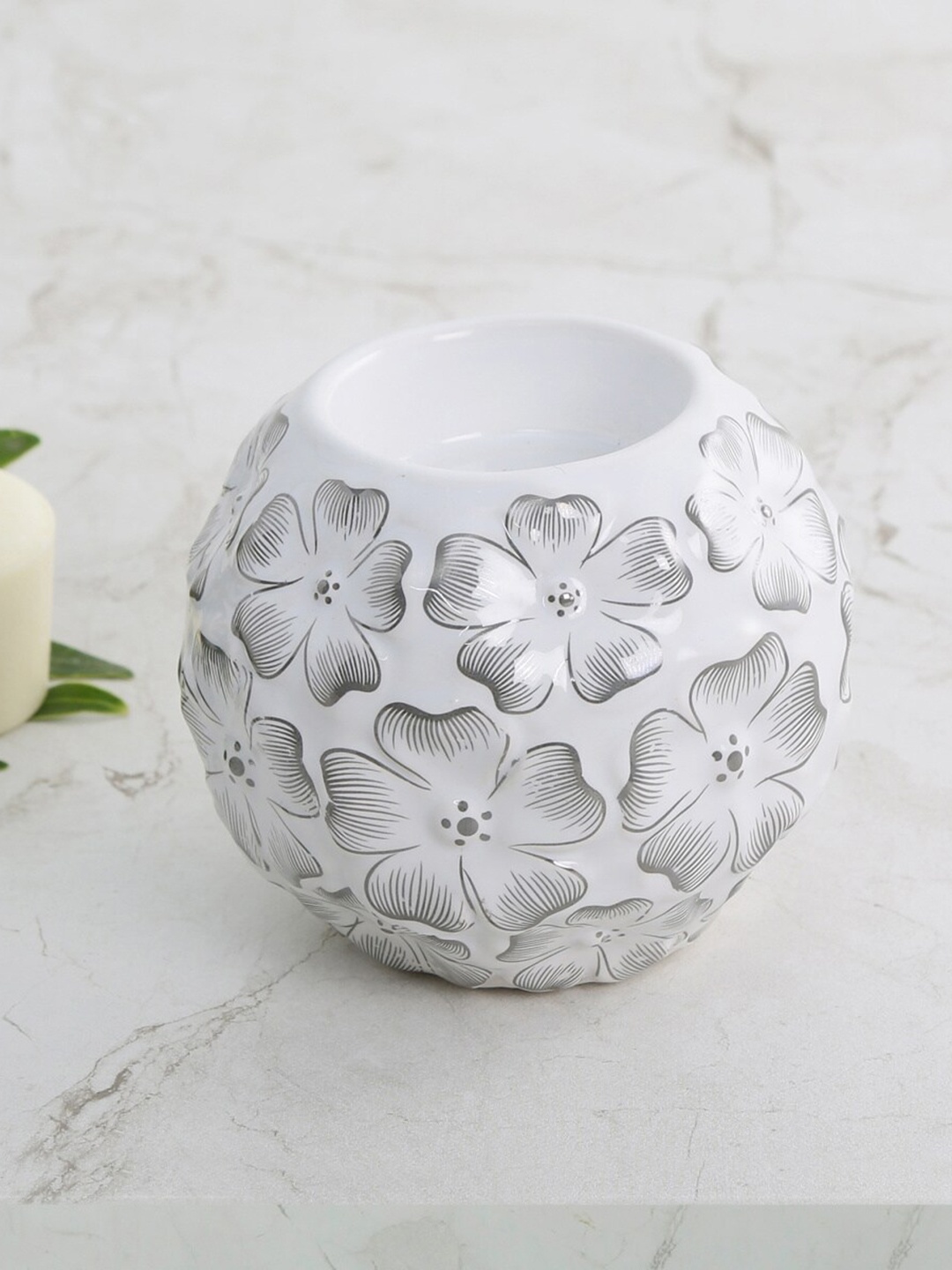 

Home Centre White Galaxy Floral Ceramic Embossed T-light Holder