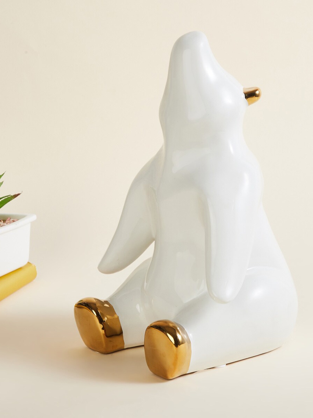 

Home Centre White And Gold -Toned Colourblocked Ceramic Bear Figurine