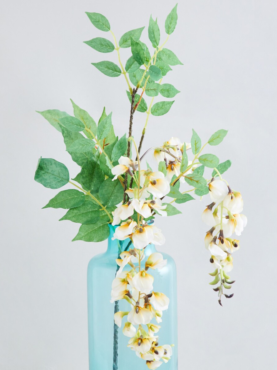 

Home Centre White & Green Artificial Plastic Flowers