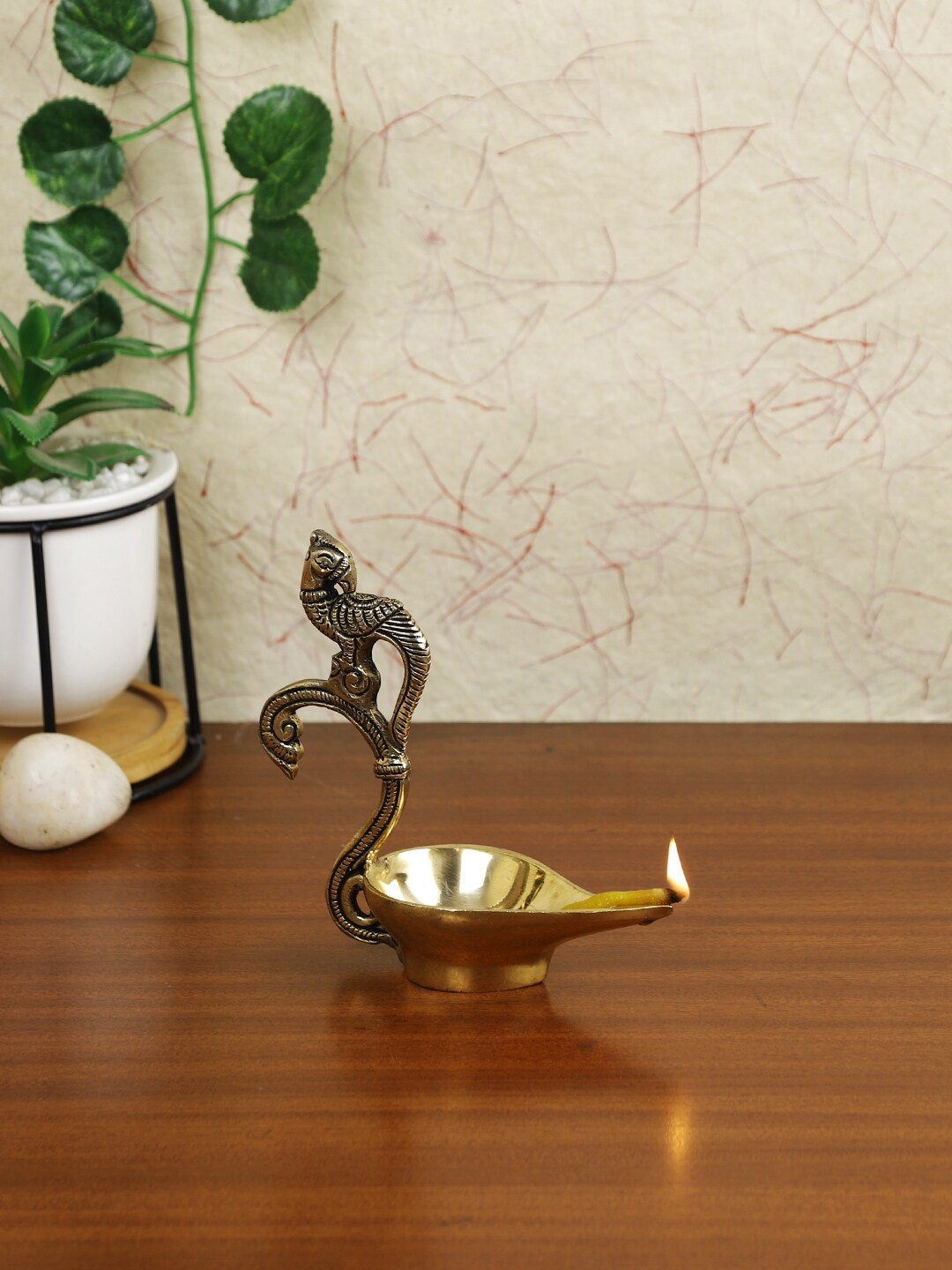 

Imli Street Gold Toned Brass Parrot Diya