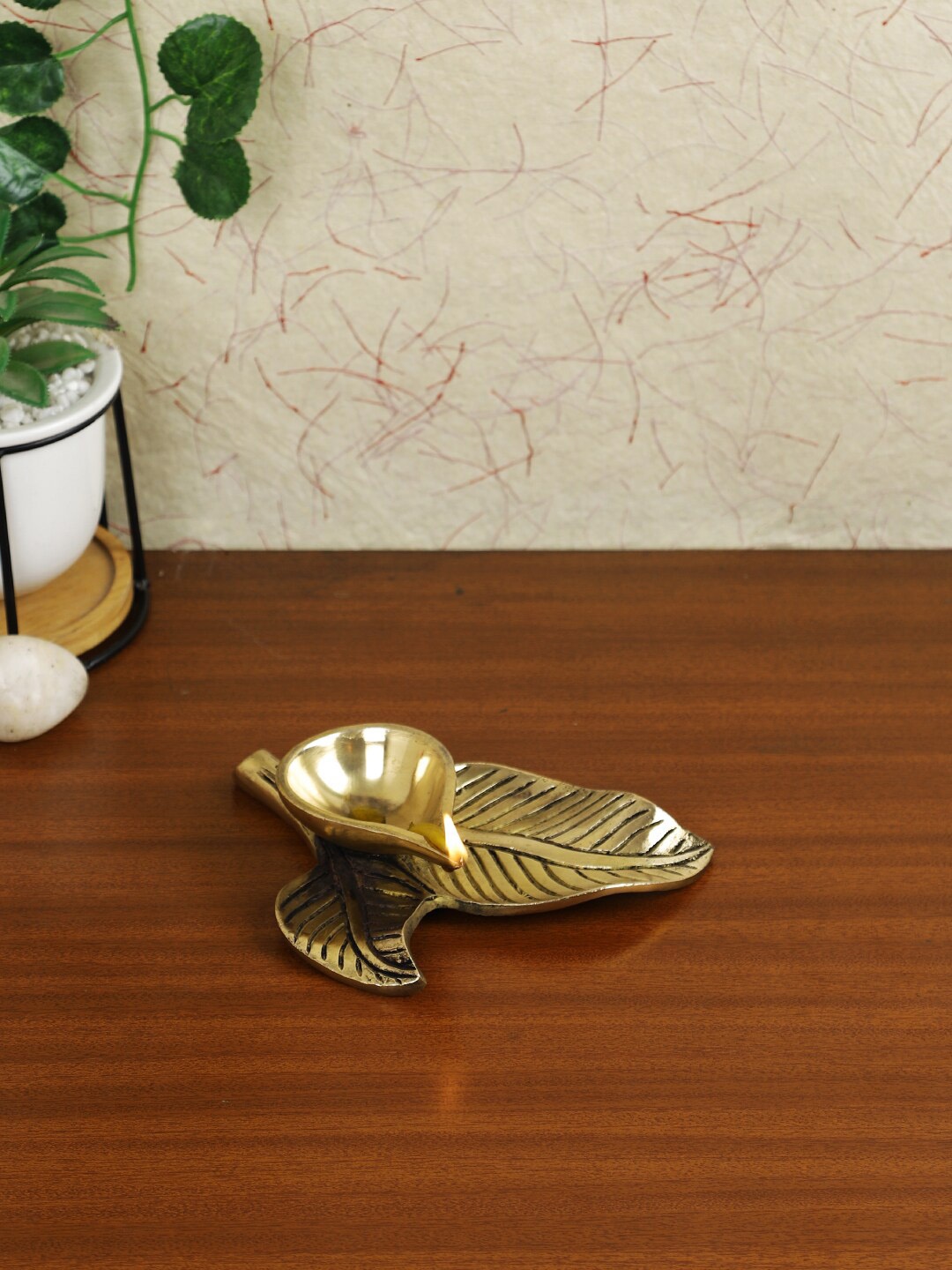 

Imli Street Gold Leaf Shaped Brass Diya