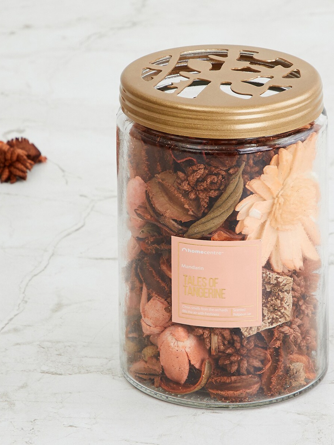 

Home Centre Orange Potpourri Glass Jar