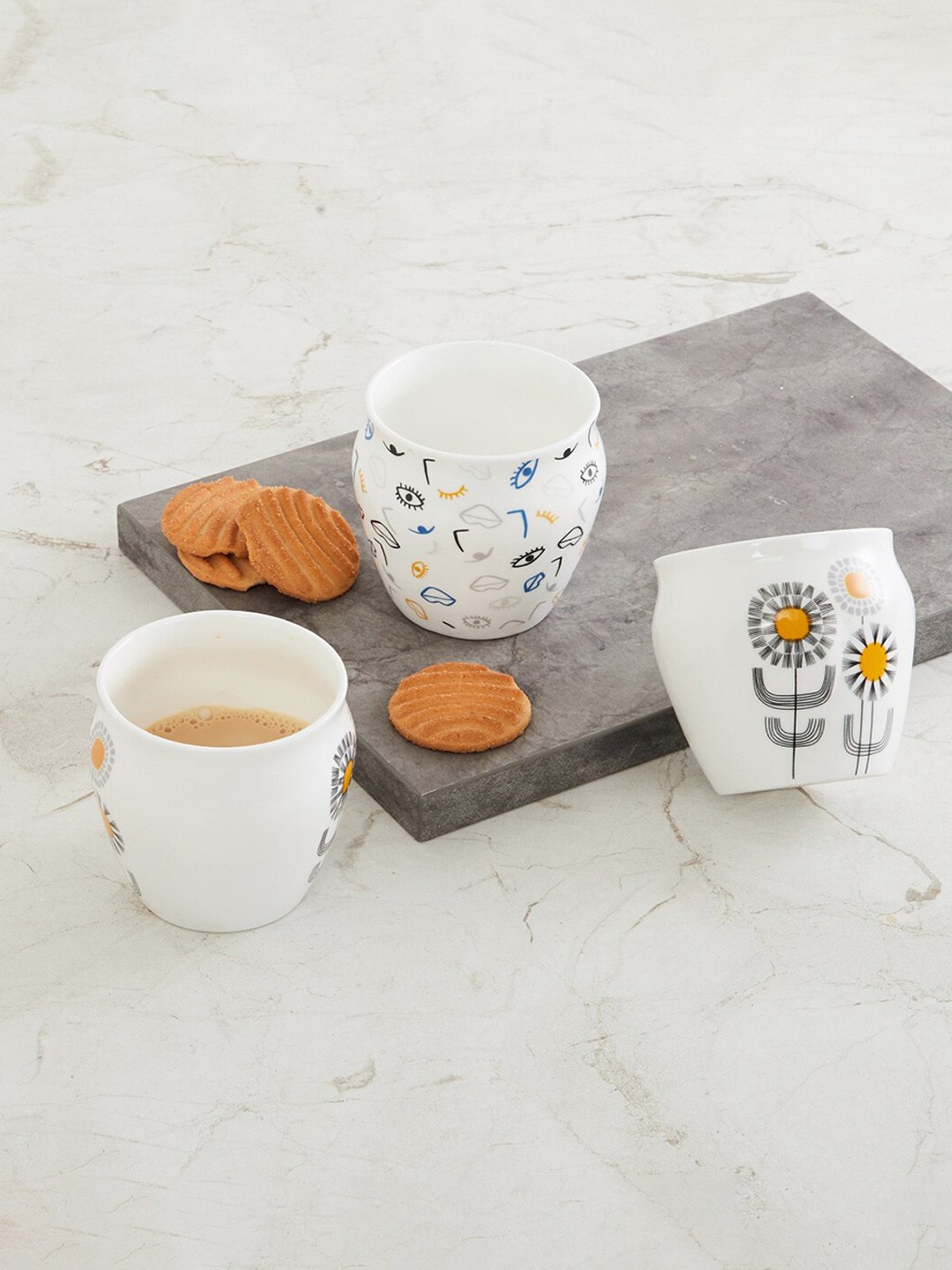 

Home Centre Set Of 3 White & Mustard Floral Printed Bone China Glossy Kulladhs