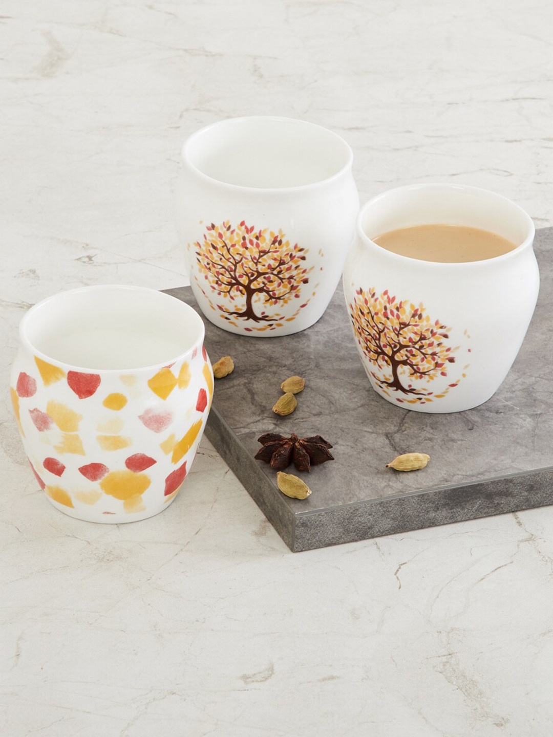 

Home Centre Set Of 3 Yellow & White Printed Bone China Kulladhs