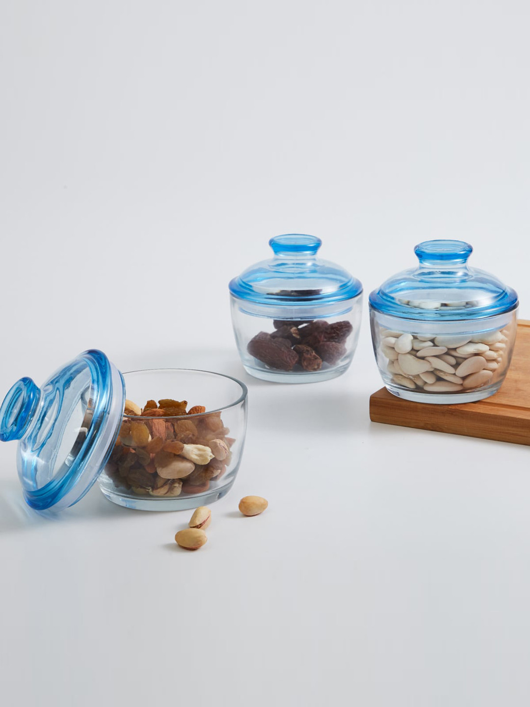 

Home Centre Set of 3 Transparent & Blue Solid Glass Jar With Lid