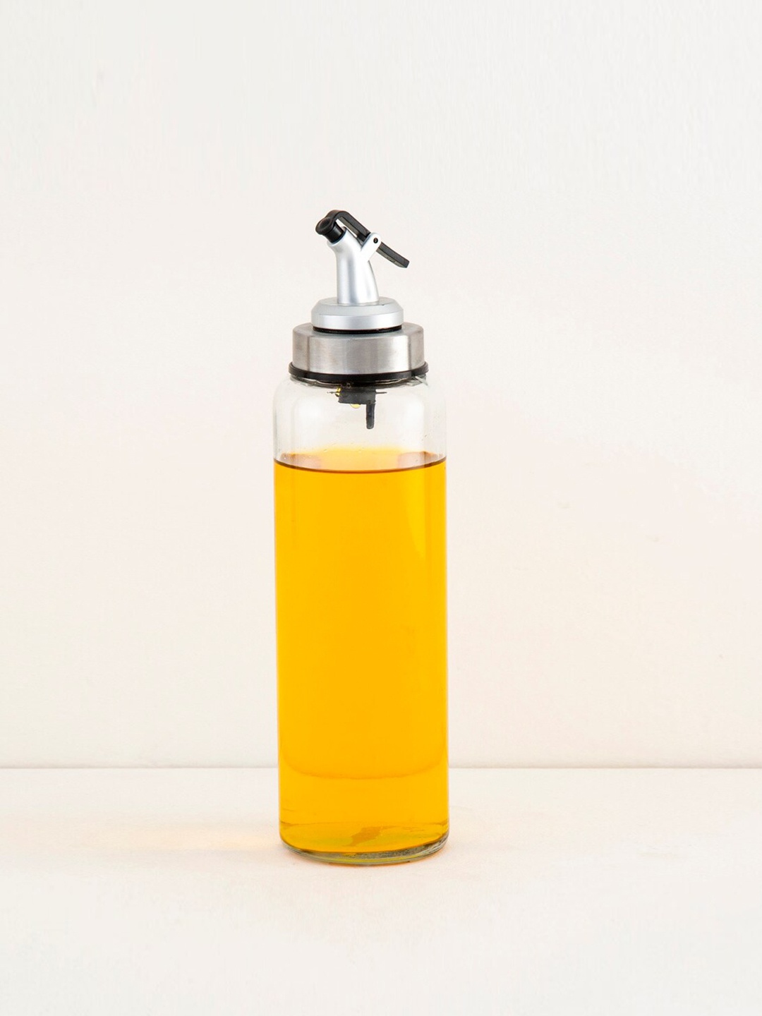 

Home Centre Transparent & Silver-Toned Solid Glass Oil Bottle With Lid - 500 ml