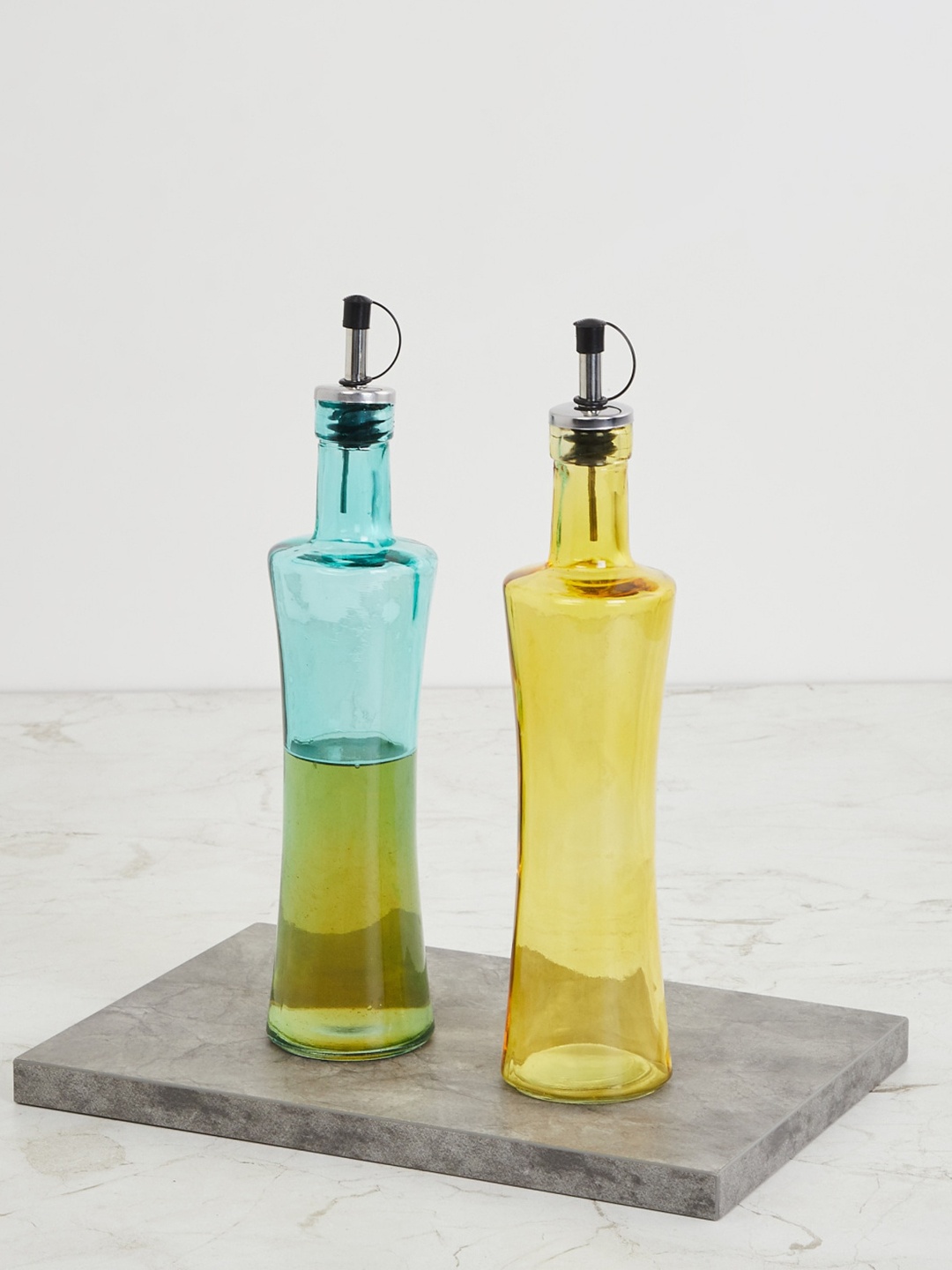 

Home Centre Set Of 2 Yellow & Blue Glass Pamolive Oil Bottle