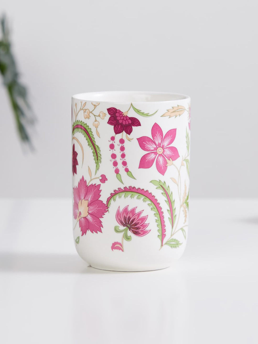 

Home Centre White & Pink Printed Ceramic Tumbler