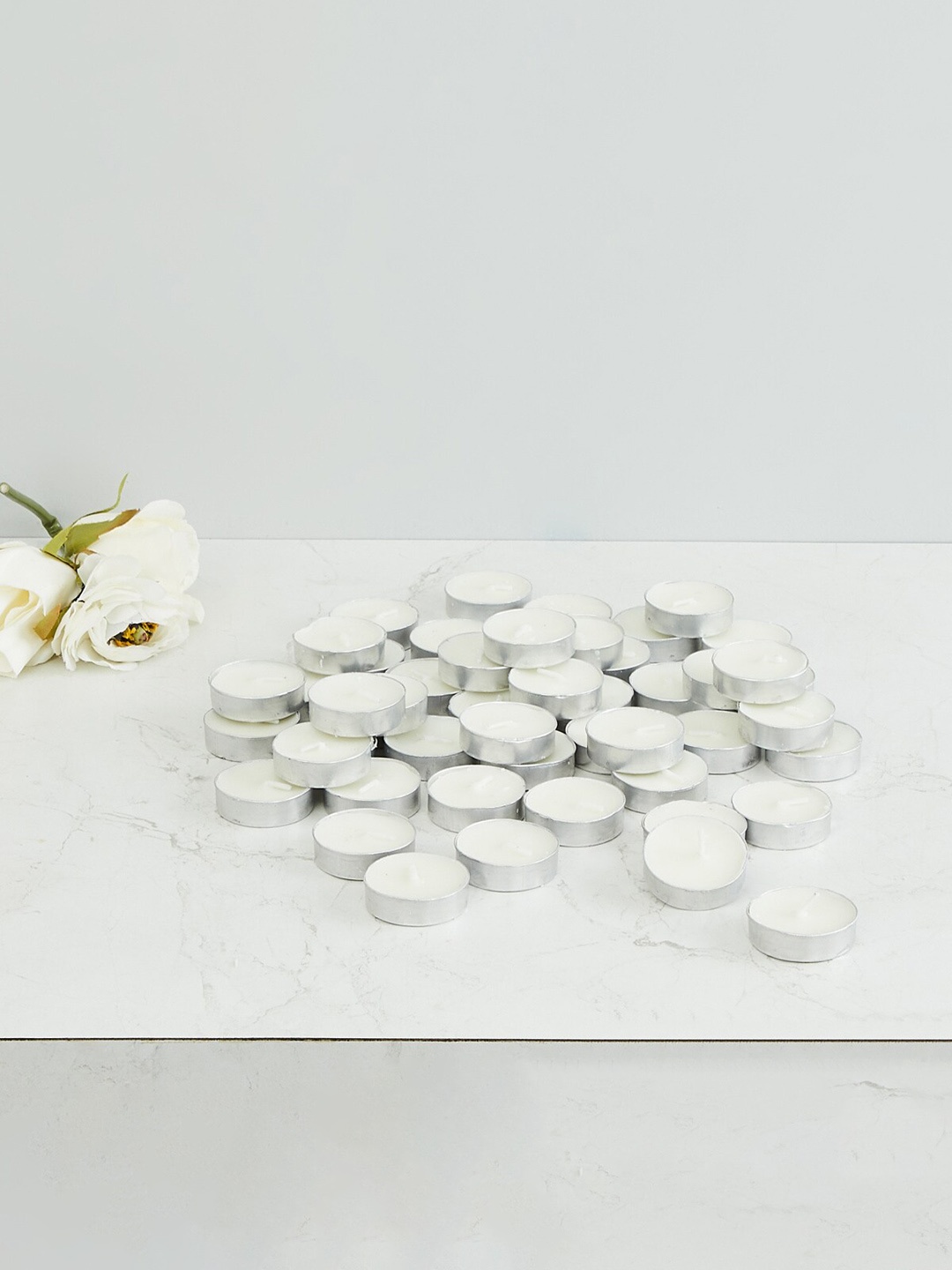 

Home Centre Set Of 50 White Luminescent T-light Candles