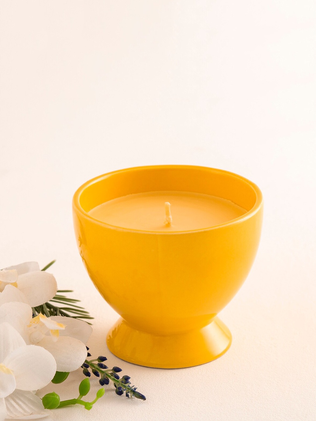 

Home Centre Yellow Ceramic Jar Scented Candle