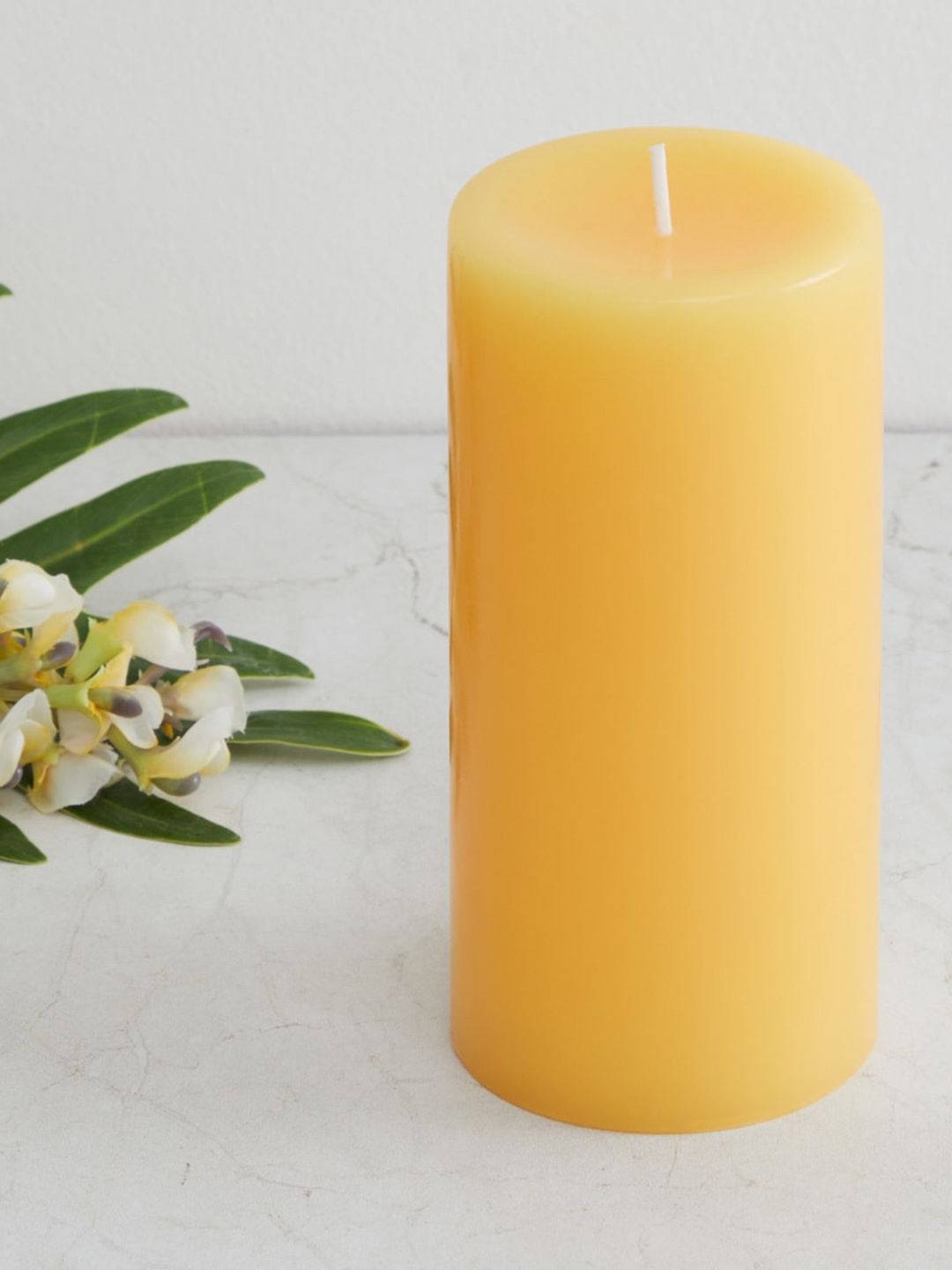 

Home Centre Yellow Round Wax Pillar Candle