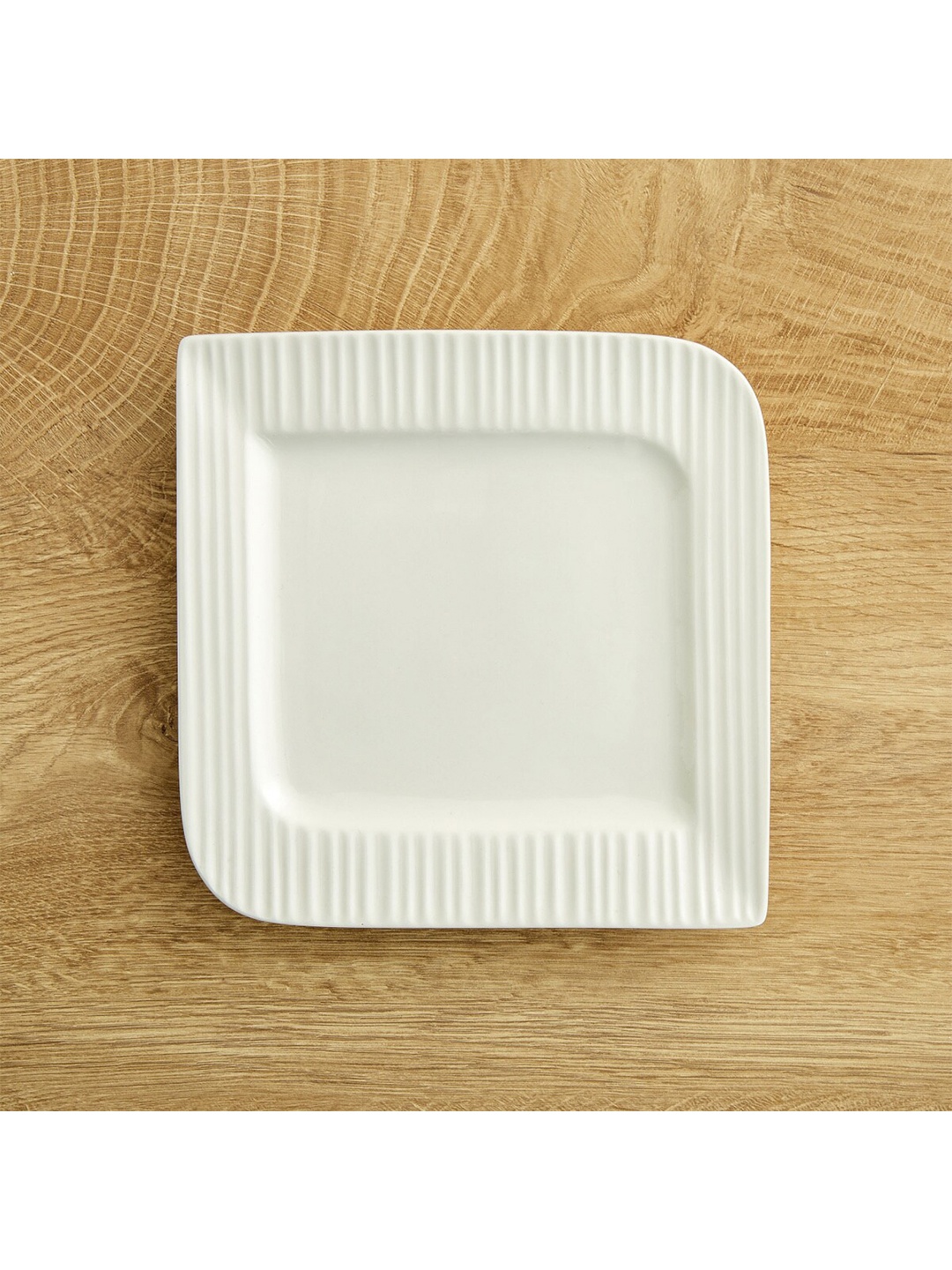 

Home Centre White & 1 Pieces Porcelain Glossy Plate