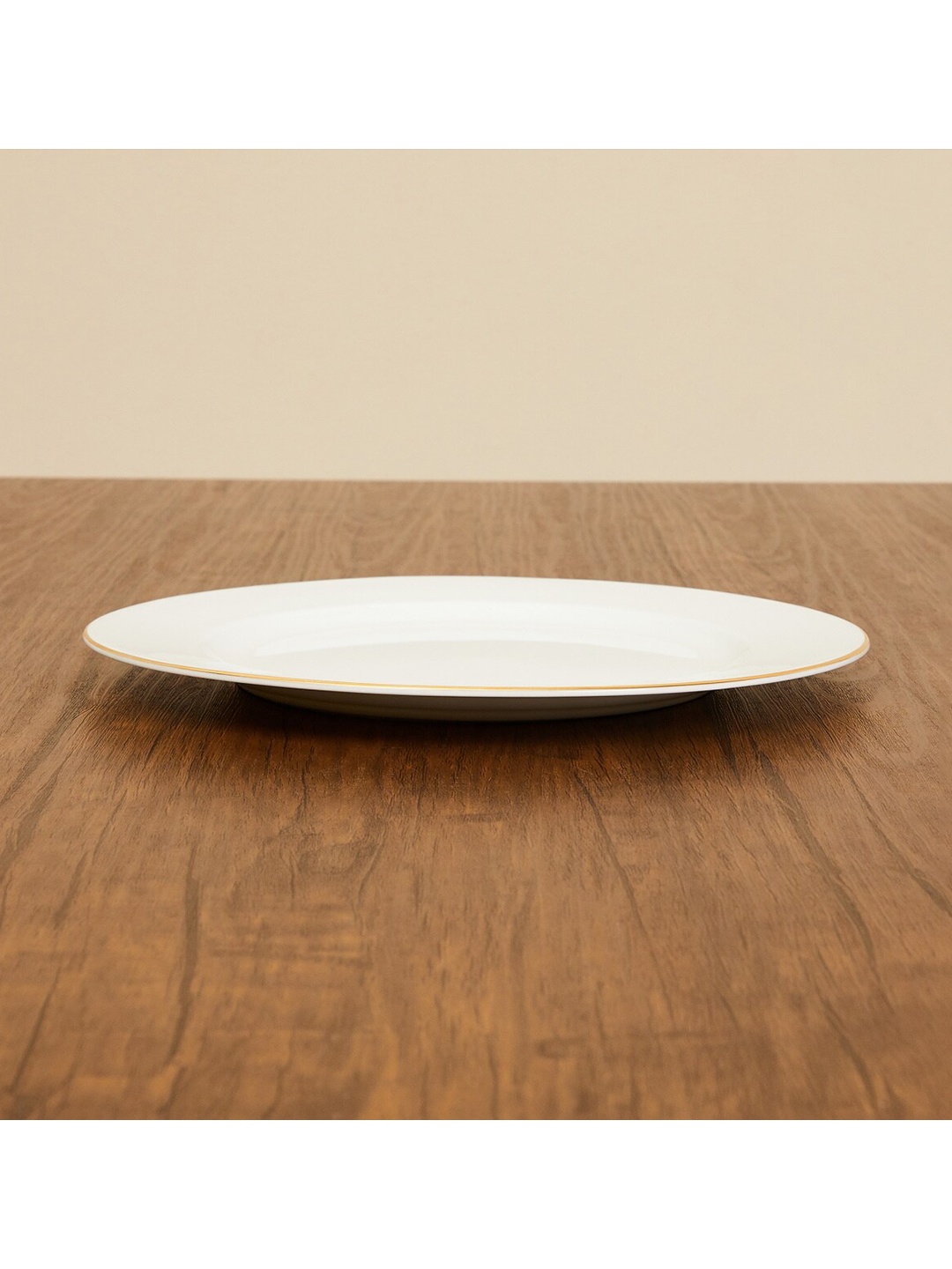 

Home Centre White 1 Pieces Bone China Glossy Plates