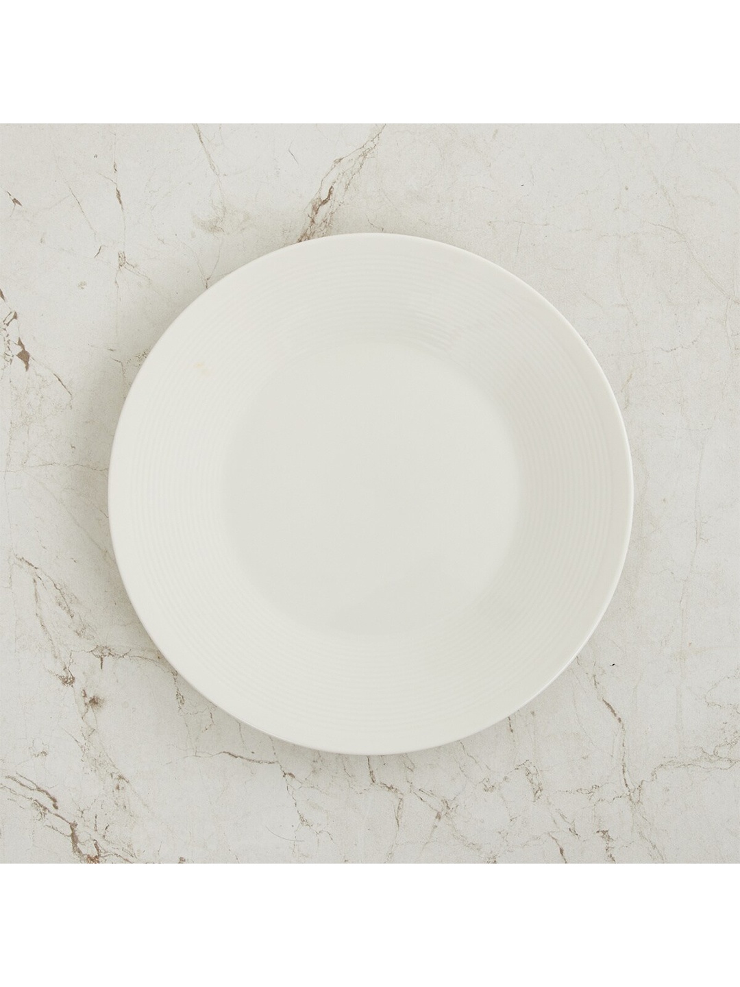

Home Centre White & 1 Pieces Porcelain Glossy Plates