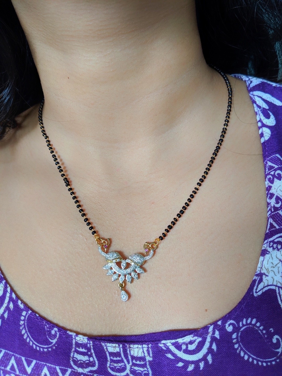 

Digital Dress Room Gold-Plated White AD Studded & Black Beaded Mangalsutra