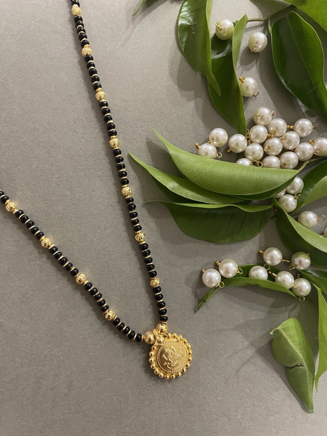 

Digital Dress Room Gold-Plated & Black Beaded Mangalsutra