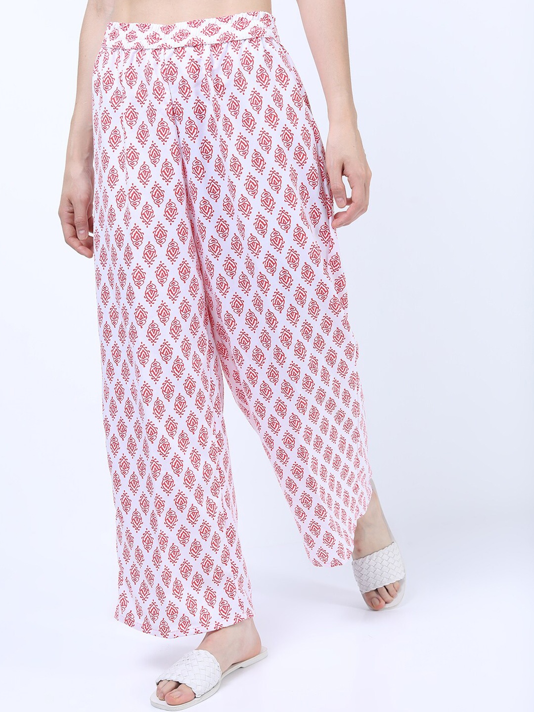 

Vishudh Women Off White & Coral Ethnic Motifs Printed Palazzos