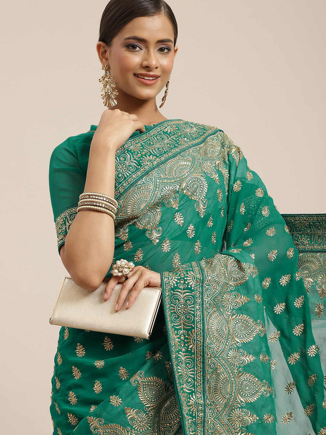

RAJGRANTH Turquoise Blue & Golden Ethnic Motifs Pure Georgette Heavy Work Saree