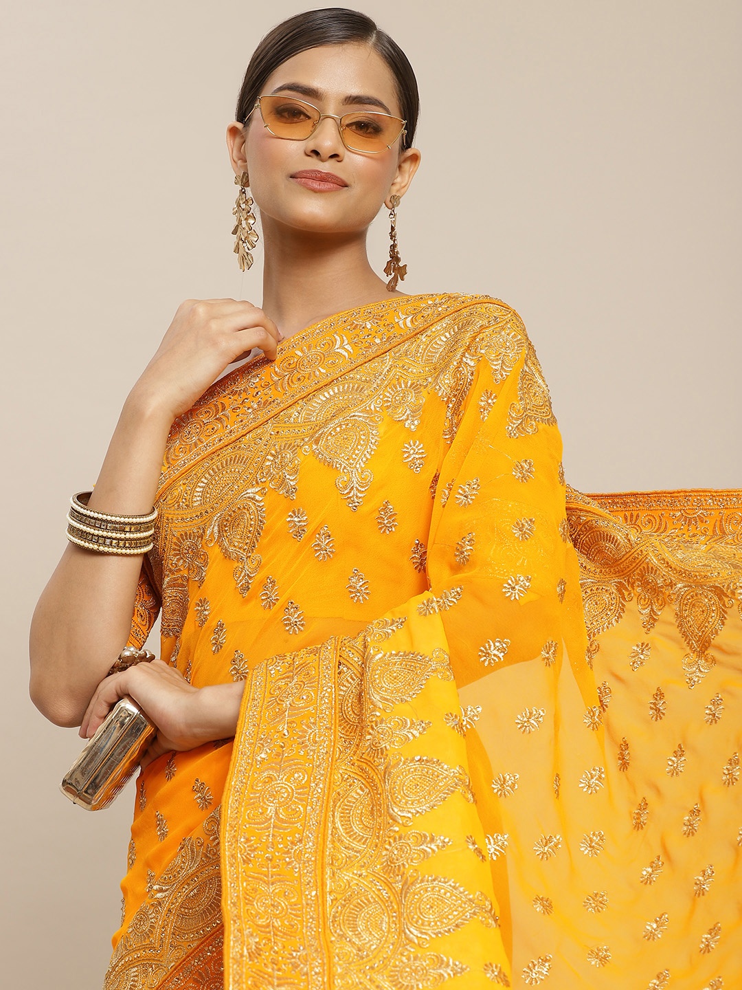 

RAJGRANTH Yellow & Golden Ethnic Motifs Beads and Stones Pure Georgette Heavy Work Saree