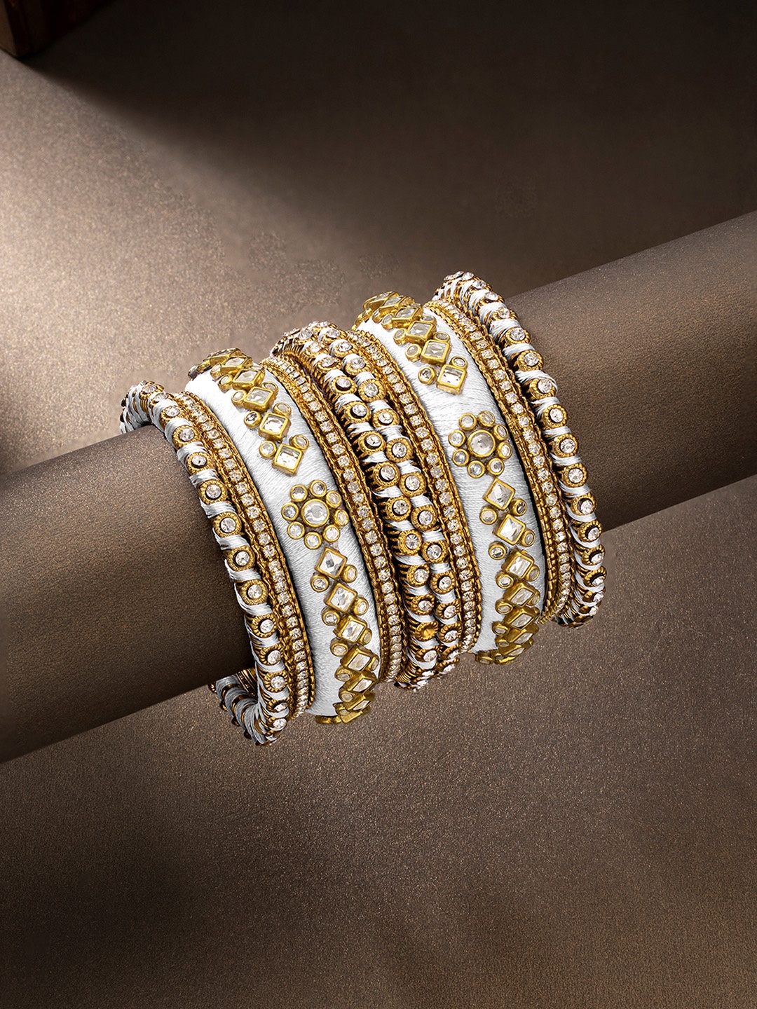 

Peora Set Of 10 White Gold-Plated Stone Studded Silk Thread Bangles