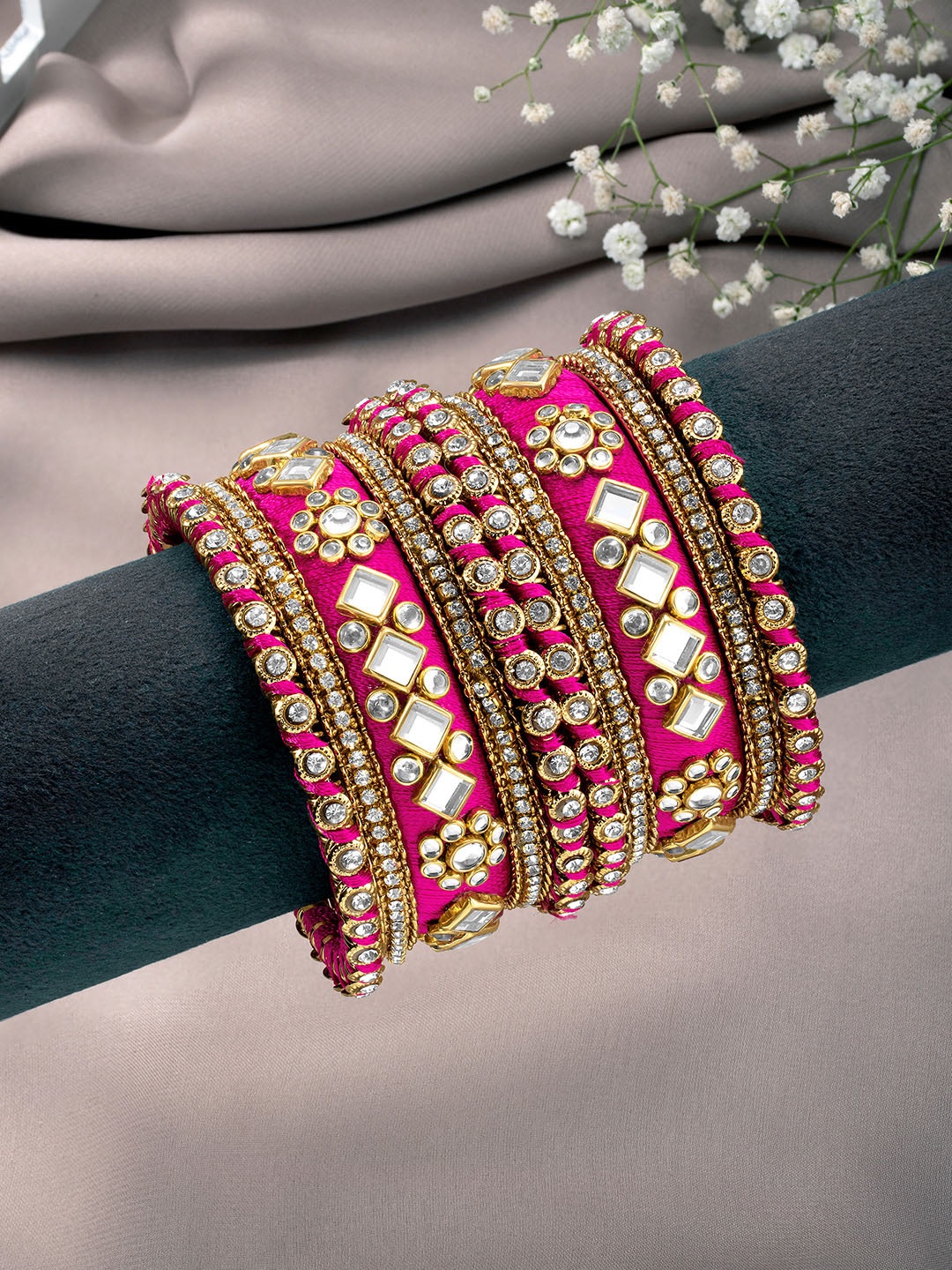 

Peora Set Of 10 Pink Gold-Plated Stone Studded Silk Thread Bangles