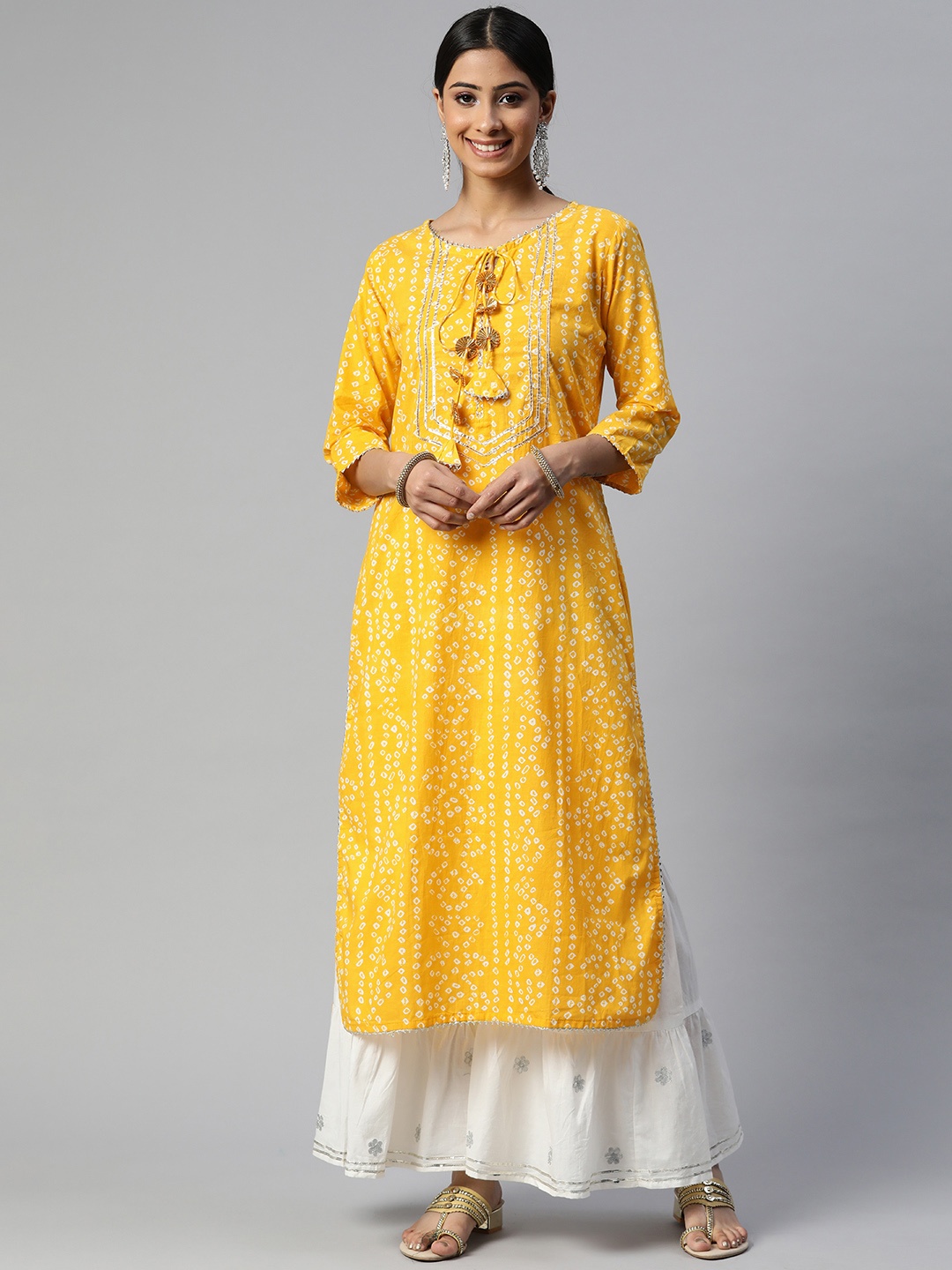 SVARCHI Women Yellow & White Bandhani Printed Gotta Patti Kurta with Sharara