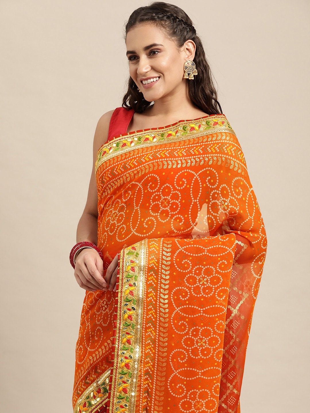 

VASTRANAND Orange & White Sequinned Bandhani Saree