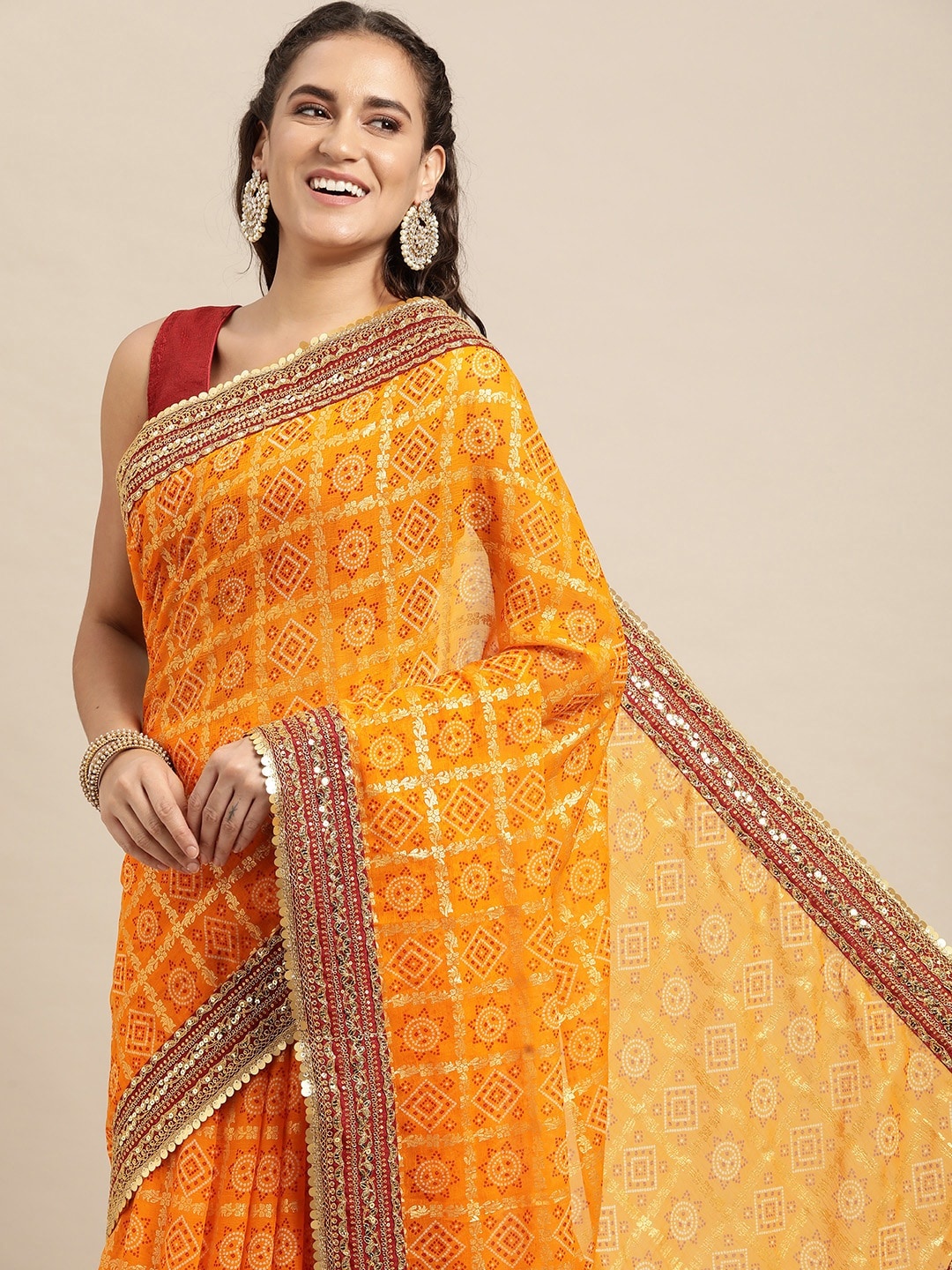 

VASTRANAND Yellow & Red Sequinned Bandhani Saree