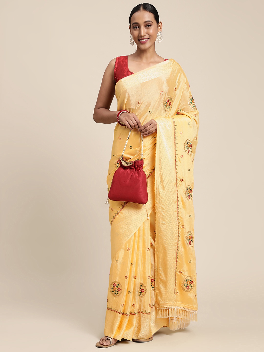 

VASTRANAND Yellow & Golden Ethnic Motifs Embroidered Saree