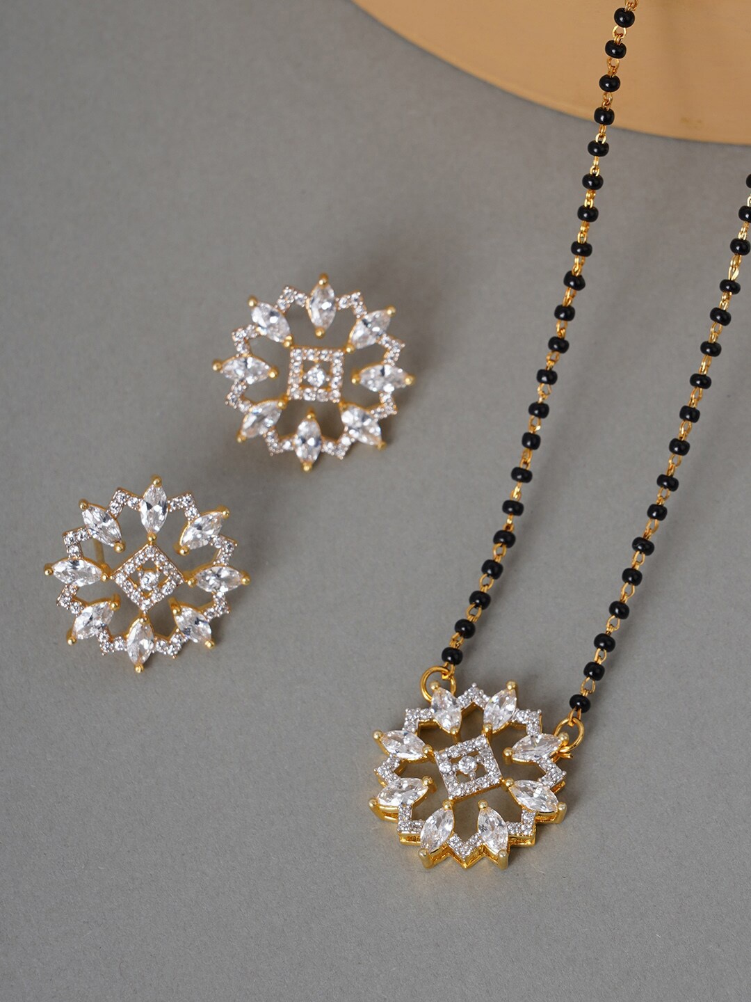 

Voylla Women Black & Gold-Plated American Diamond CZ Beaded Mangalsutra & Earrings