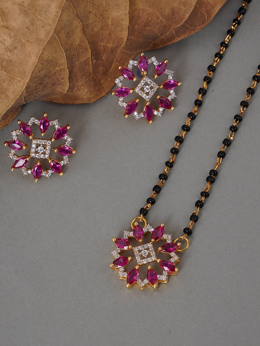 

Voylla Women Red Gold-Plated AD CZ Flower Black Beaded Mangalsutra With Earrings