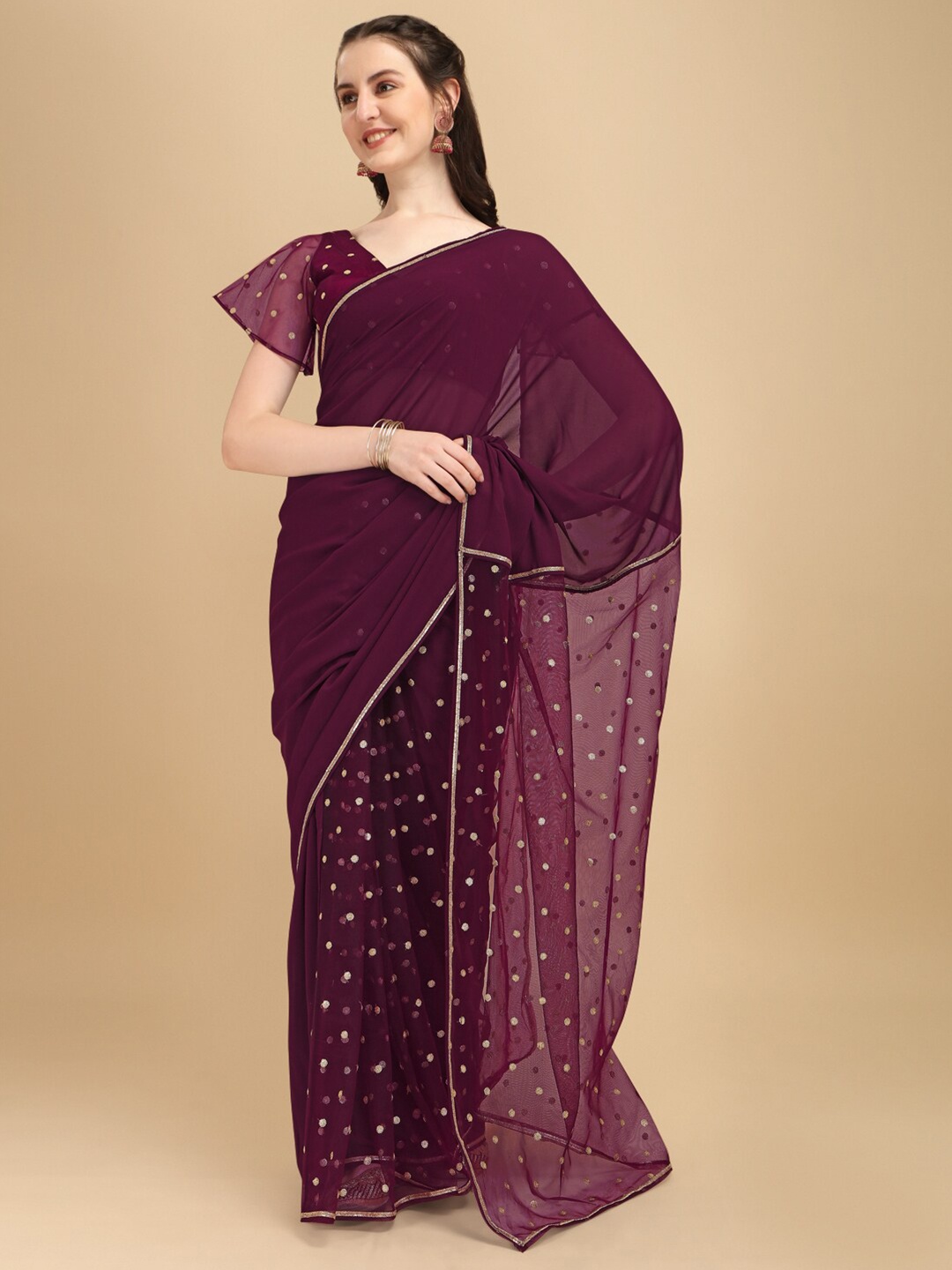 

Sangria Burgundy & Golden Embellished Sequinned Net Fusion Saree