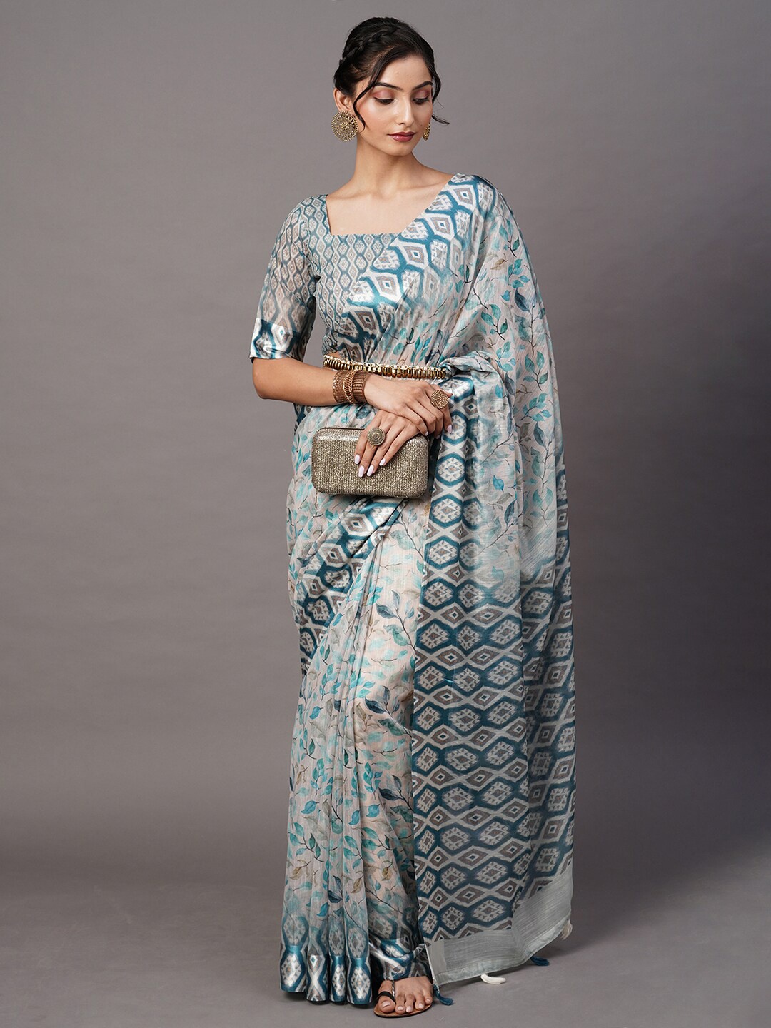 

Mitera Off White & Blue Ethnic Motifs Saree