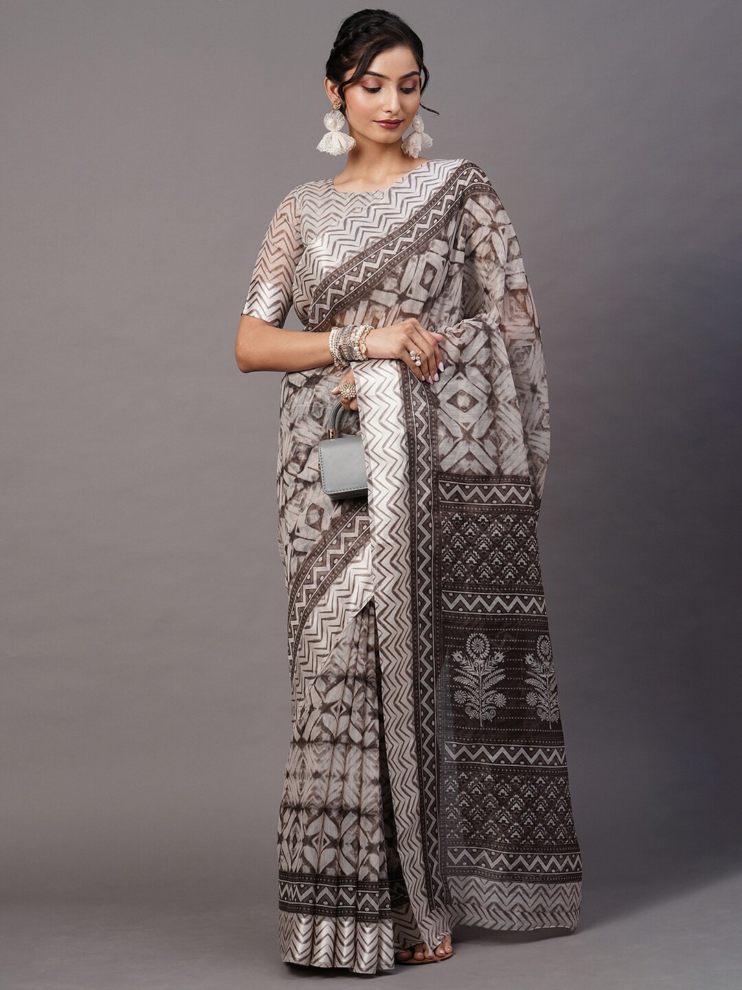 

Mitera Grey & Beige Ethnic Motifs Printed Cotton Blend Ikat Saree