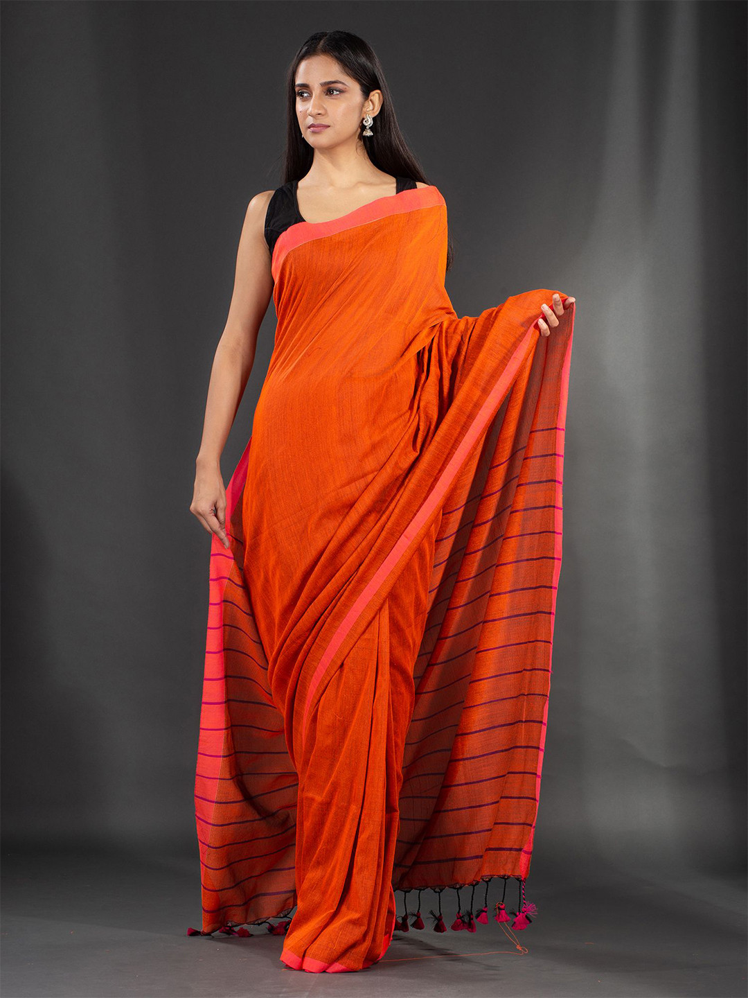 

Charukriti Orange Solid Pure Cotton Saree
