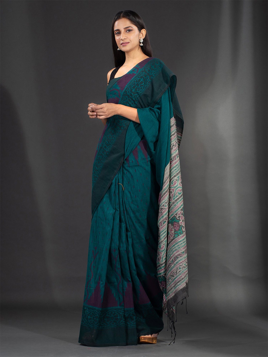 

Charukriti Teal Blue & Magenta Floral Pure Cotton Saree