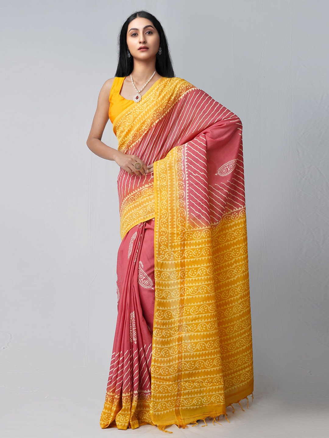 

Unnati Silks Pink & Yellow Ethnic Motifs Silk Blend Patola Saree