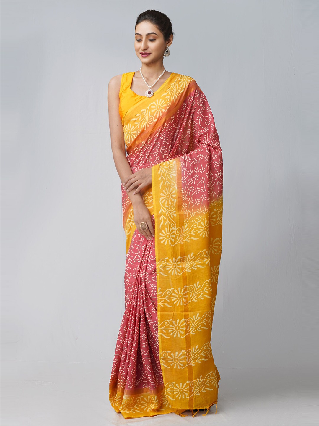 

Unnati Silks Pink & Yellow Ethnic Motifs Silk Blend Patola Saree