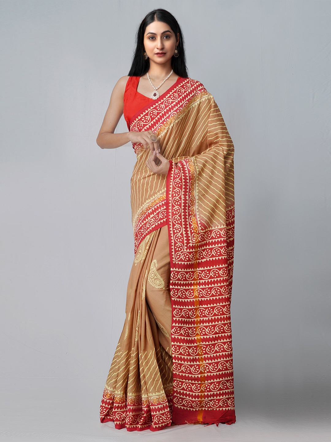 

Unnati Silks Brown & Red Ethnic Motifs Silk Blend Patola Saree