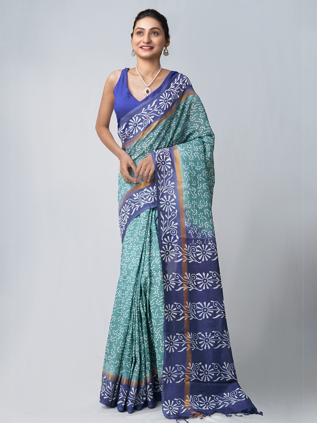 

Unnati Silks Green & Blue Ethnic Motifs Zari Silk Blend Patola Saree