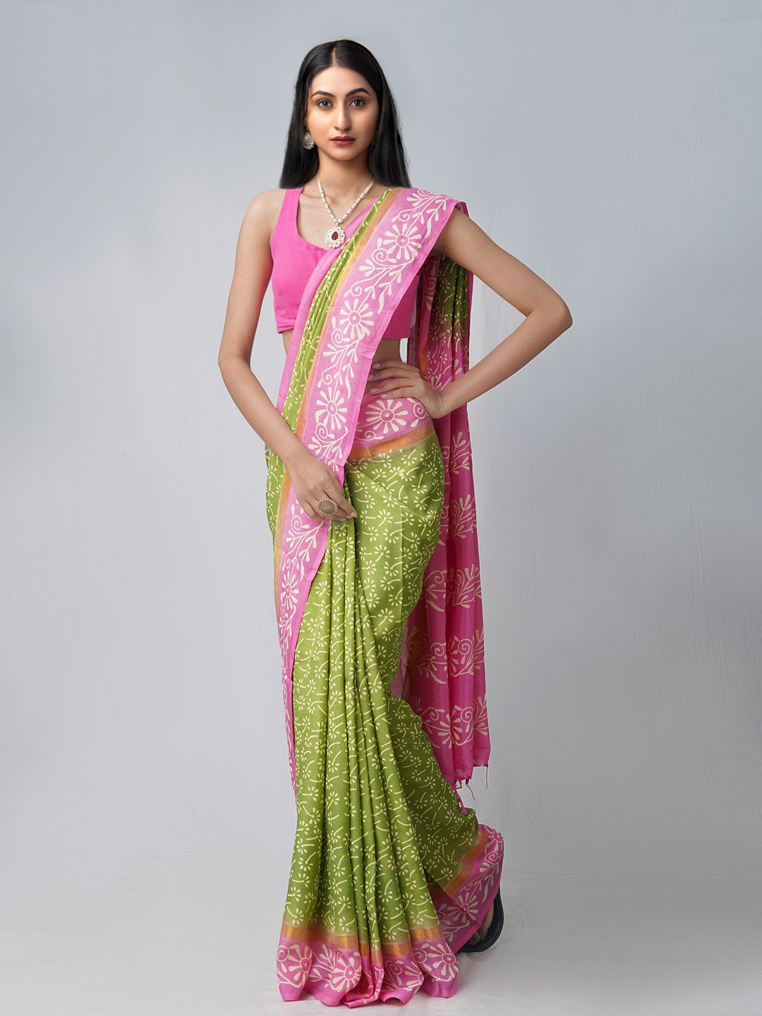 

Unnati Silks Green & Pink Floral Silk Blend Patola Saree