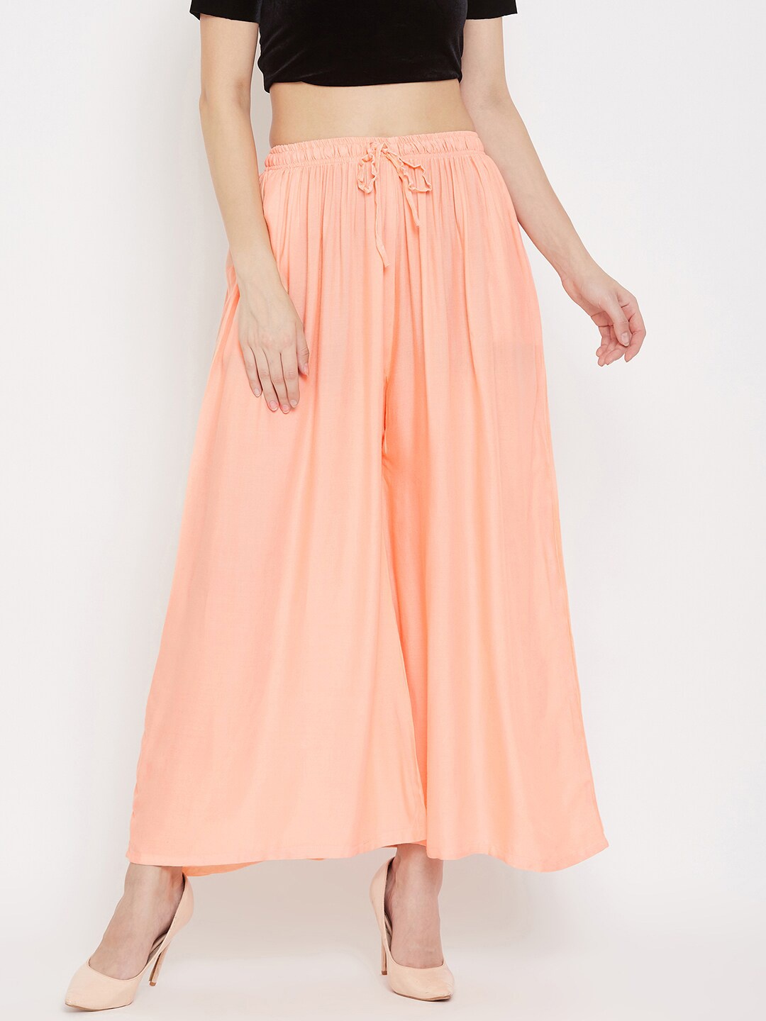 

Clora Creation Women Peach-Coloured Flared Palazzos