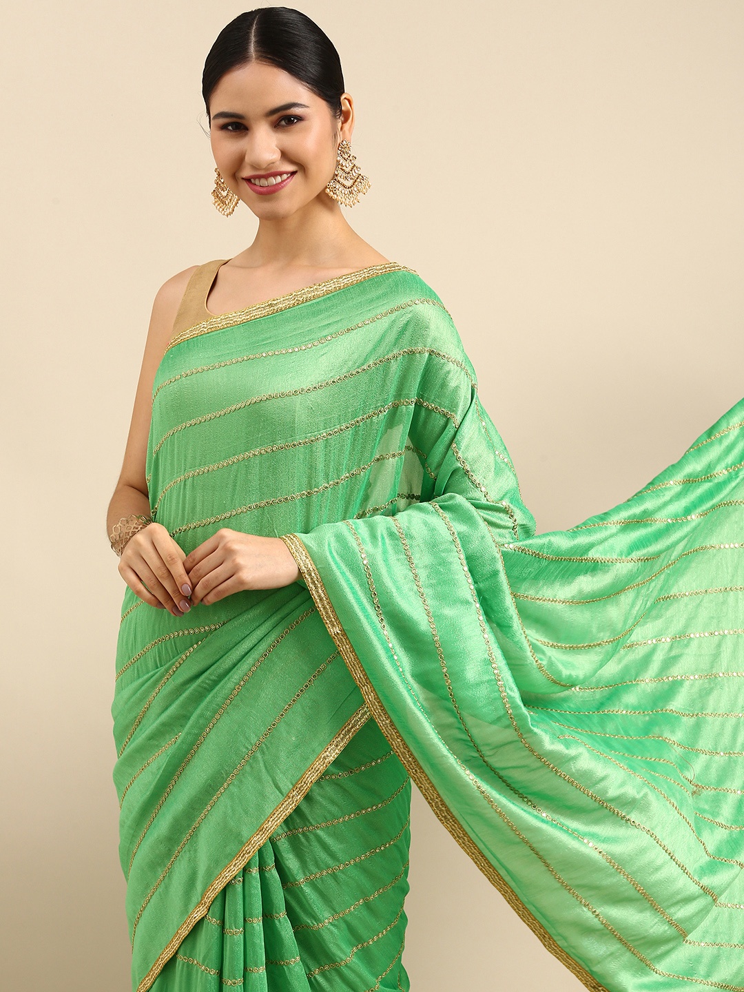 

Anouk Green & Gold-Toned Striped Sequinned Silk Blend Saree