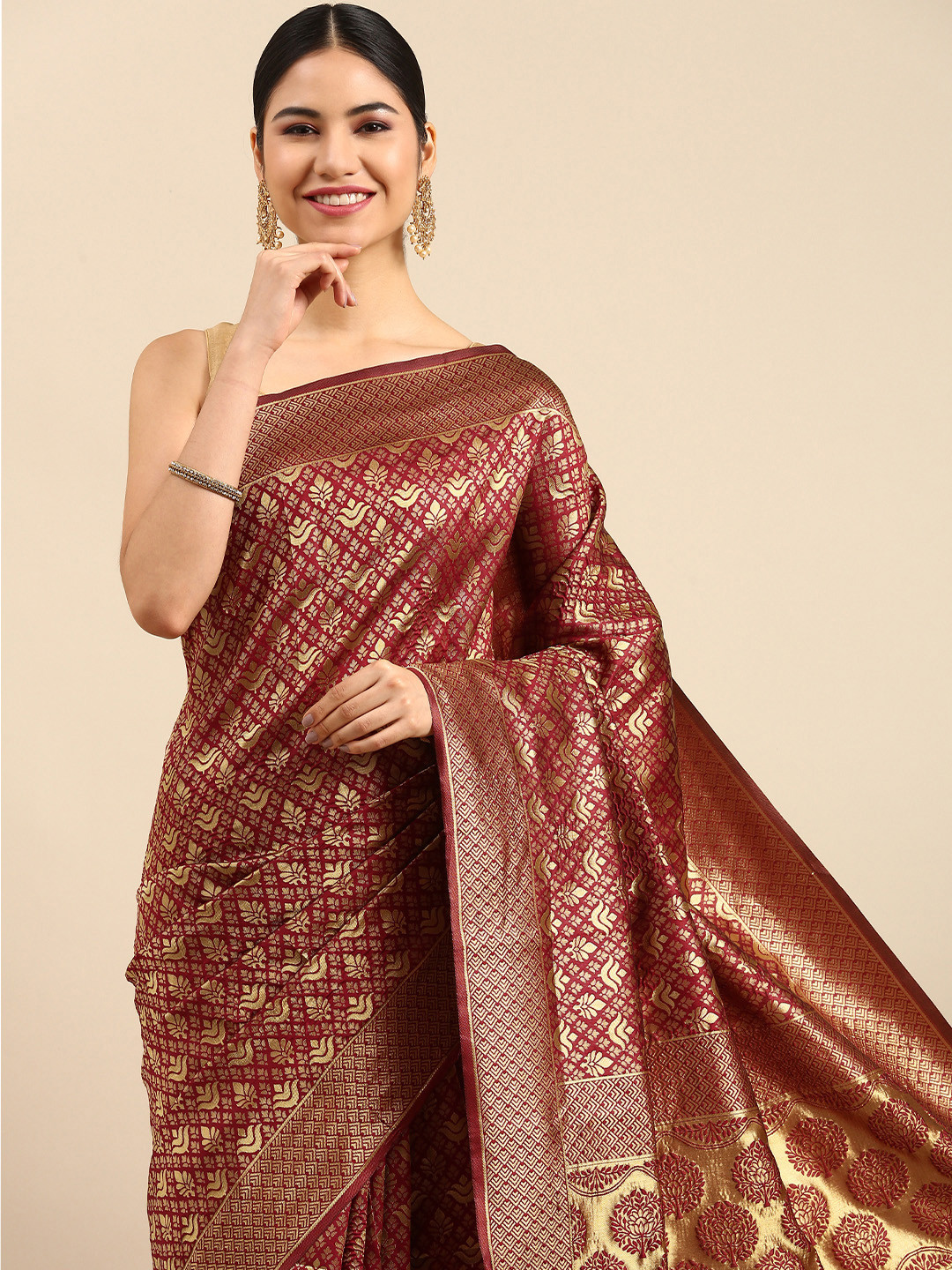 

Anouk Maroon & Gold-Toned Ethnic Motifs Zari Silk Blend Banarasi Saree