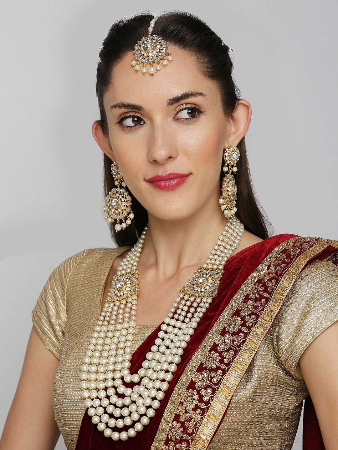 

OOMPH Gold-Toned & White Kundan Studded & Pearls Beaded Jadau Jewellery Set