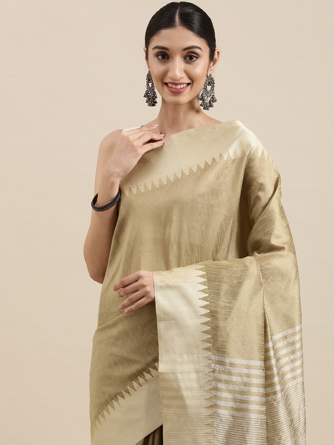 

Mitera Beige & Golden Solid Woven Border Saree